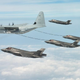 Illustration for article titled These photos of four F-35s refueling in the air are so amazing